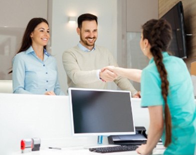 team member going over financial options with patient in Family Dental Center of East Texas   